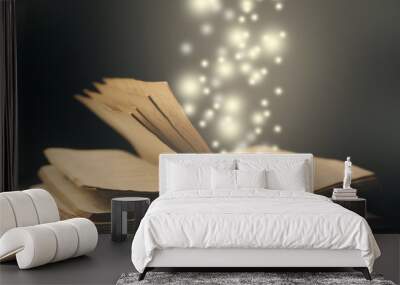 old book open light  effect moving up particles photo Wall mural