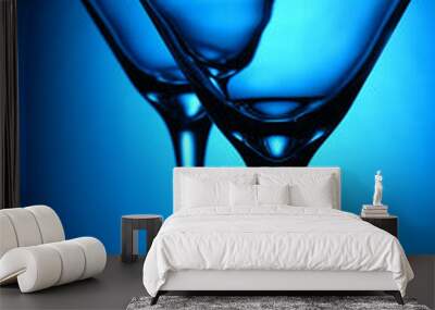 two coctail glasses on a blue Wall mural