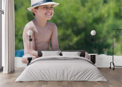 Boy playing on the beach Wall mural