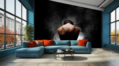 half silhouette modern ballet dancer posing on dark background with smoke Wall mural