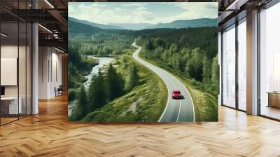 Generative AI. Concept of auto travel during the holiday season. One red car is driving along an asphalt mountain road along a clear river and a green summer forest. Aerial view. Road trip journey. Wall mural