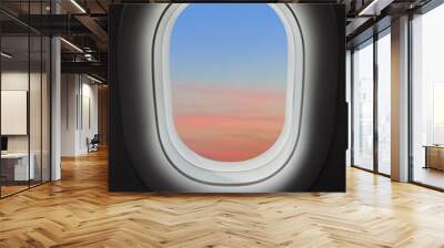 Sunset sky in airplane window Wall mural