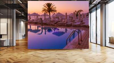 Swimming pool on Cyprus island at sunset Wall mural