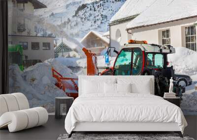 Tractor blower cleaning snow in street Wall mural