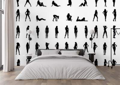 Black silhouettes of beautiful girls in various poses, vector Wall mural