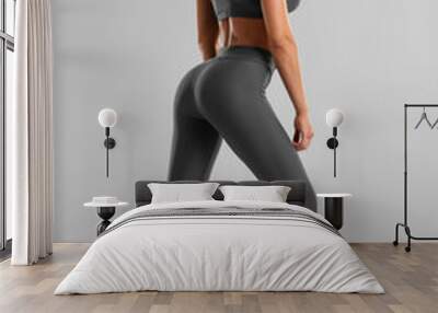 Beautiful fitness woman. Athletic girl on the gray background Wall mural