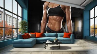 Sexy athletic girl working out in gym. Fitness woman doing exercise, abs Wall mural