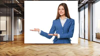 Smiling woman showing open hand palm with copy space for product or text. Business woman in blue suit, isolated over white background Wall mural