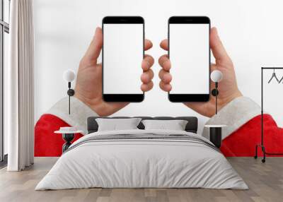 Santa's hand in two different position holding black modern phone with empty screen, isolated on white background Wall mural