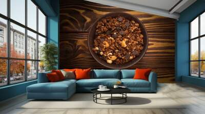 Chocolate granola cereal with nuts in a bowl. Wall mural