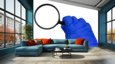 doctor's hand in blue glove with magnifying glass, 
isolat Wall mural