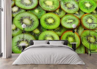 Top view of heap of sliced kiwi as textured background. Wall mural