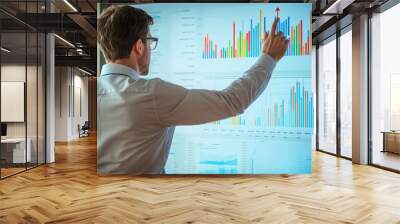 Business consultant presenting clear upward arrow charts on a presentation screen, indicating progress Wall mural