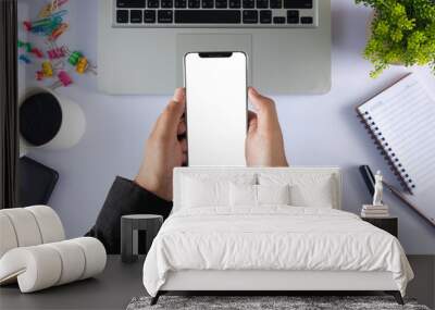 close-up on hand holding phone showing white screen Wall mural