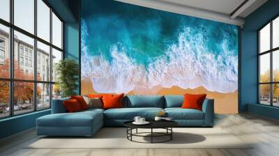 Top view of a serene ocean with sunlit waves and a golden sandy beach, perfect for showcasing tropical beauty Wall mural