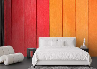 Vivid background from orange and red wooden planks. Autumnal Wooden textured background in two colours. Red and orange painted wooden boards arranged vertically in a row. Wall mural