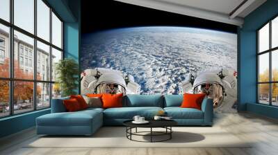 high resolution planet earth two astronauts spaceman helmet suit floating people outer space walk. e Wall mural