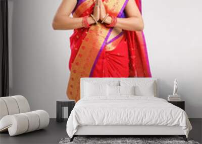  young Indian woman wearing  Sari  and showing a welcome gestures, isolated on white background Wall mural