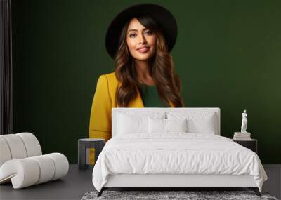 Beautiful woman in stylish yellow suit with hat. Wall mural