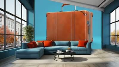 Business suitcase on blue background Wall mural