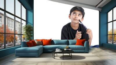 Cute Indian boy thinking idea and looking at up, isolated on white background  Wall mural