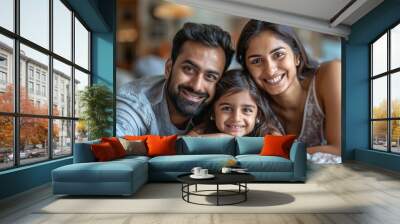 happy indian family sitting together at home Wall mural