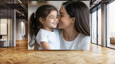 Indian Cute little preschooler daughter hug cuddle with smiling young mother Wall mural