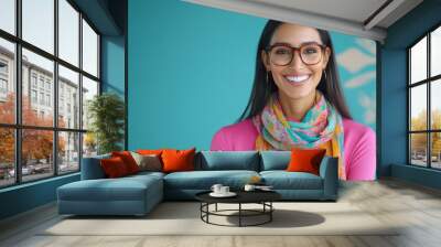 indian female fashion designer holding a dress in hand, cheerfully smiling Wall mural