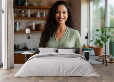 Indian housewife smiling and showing some bottle Wall mural