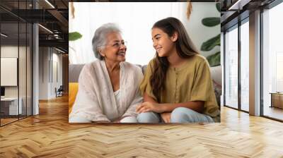 indian senior woman spending time with grand daughter Wall mural