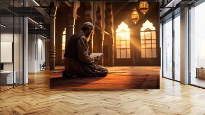 Islamic religious man reading holy book quran. Wall mural