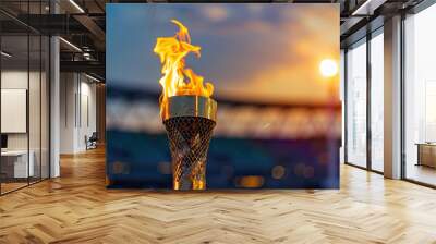 The Olympic flame is burning in the modern stadium, with a blurred background Wall mural