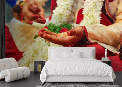 Traditional indian wedding ceremony, groom holding hand in bride hand Wall mural