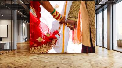 Traditional indian wedding ceremony, groom holding hand in bride hand Wall mural