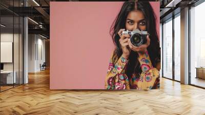 young beautiful indian woman holding camera Wall mural