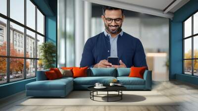 young handsome man using smartphone at office Wall mural