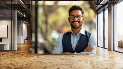 young indian businessman standing confidently at park Wall mural