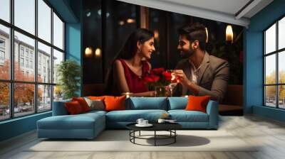 Young indian couple enjoys romantic dinner at restaurant Wall mural