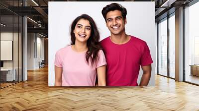 Young indian couple standing together and giving happy expression. Wall mural