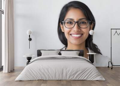 Young indian woman wearing eyeglasses smiling on white background Wall mural