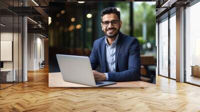 young successful businessman using laptop Wall mural