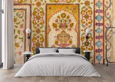 A floral design on the wall of the Ganesh Pol at Amber Fort in Rajasthan, India. Wall mural