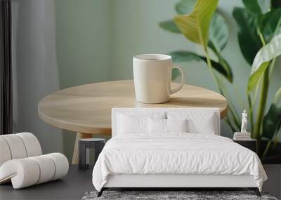 A peaceful morning scene featuring a simple mug on a wooden table surrounded by lush greenery and natural light Wall mural