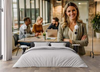 Confident businesswoman smiling at camera in modern office. Wall mural