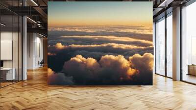 aerial view of an epic sunset above the clouds going under the horizon. evening sun background. heaven-like sunrise landscape photo in the sky.  Wall mural