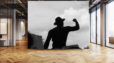 Grayscale of a male in hat fighting for human rights Wall mural