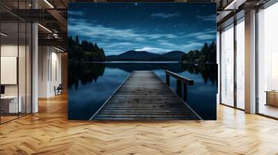 A starry night sky reflecting on a calm lake, with a dock leading into the water.  Wall mural