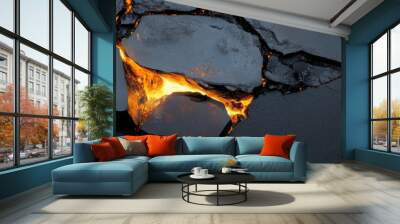 A captivating abstract image of a cracked lava stone background with glowing orange light emanating from the crevices. The image symbolizes power, heat, energy, and the raw beauty of nature. Wall mural