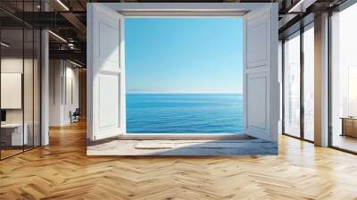 A captivating image of an open window revealing a stunning view of the sea on a sunny day. The azure sky meets the sparkling blue water, creating a sense of freedom and tranquility. The white shutters Wall mural