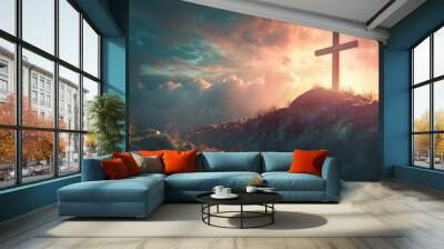 A silhouette of a cross on a hilltop with a dramatic sunset sky in the background. Wall mural